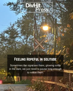 Railway crossing signal glowing under evening streetlight in Cloverdale — DivHit Press photo story on hope, solitude, and quiet moments.